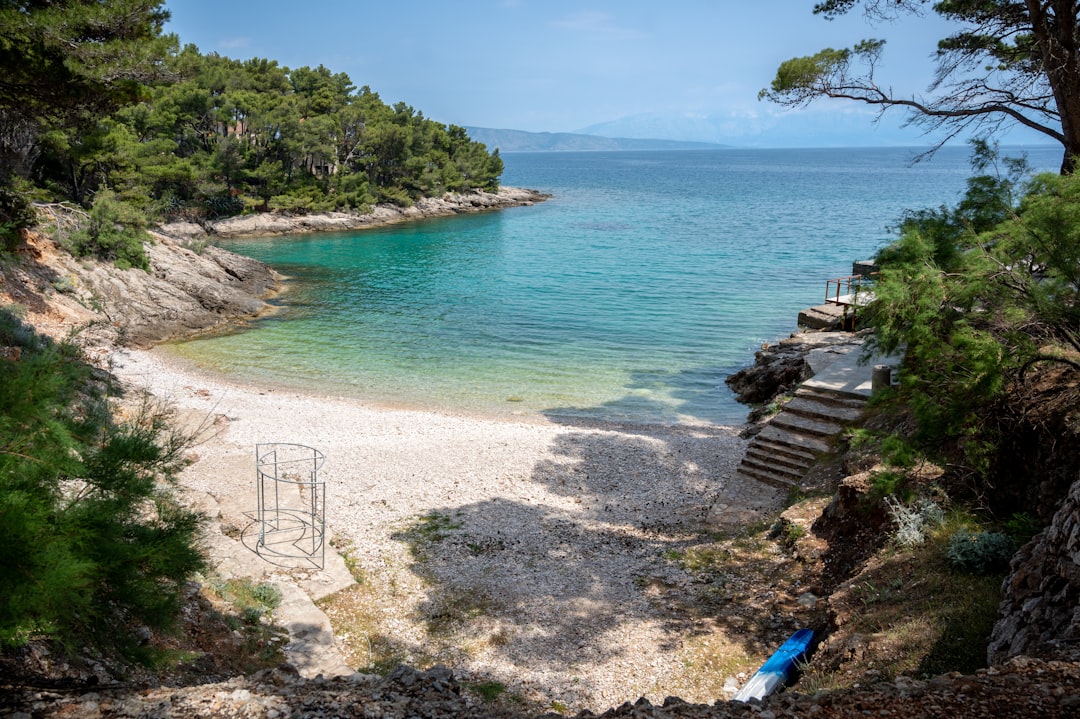 Orahovac Beach Montenegro secluded cove crystal clear water cliffs