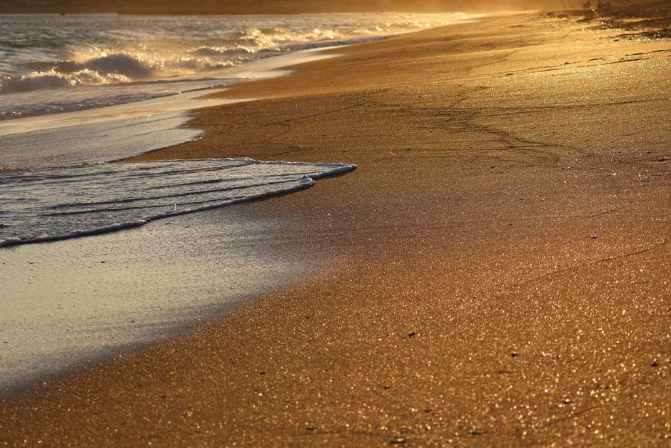 Turgutreis Beach Bodrum Turkey sandy shore gentle waves sunset cliffs