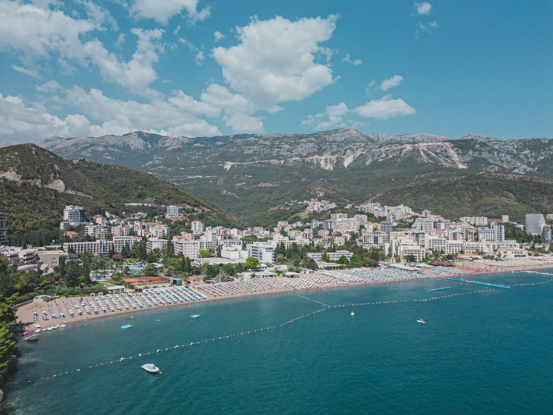 Lavsa Beach Montenegro pebble shore turquoise water summer crowd