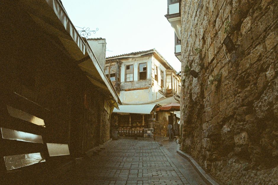 Sozopol Old Town wooden houses narrow cobblestone street sunset orange light