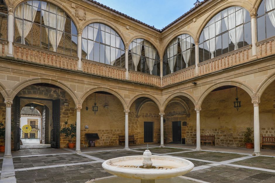 Rila Monastery central courtyard fountain wooden galleries monks walking