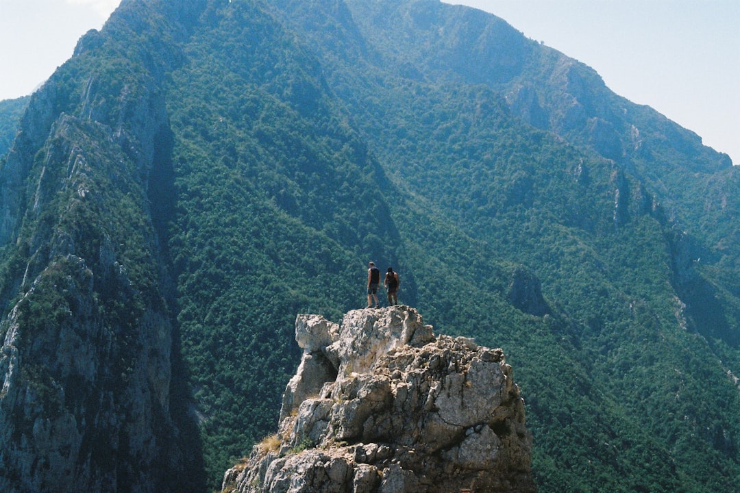 Raja e Kalit Pass Albania rocky trail mountain view hikers