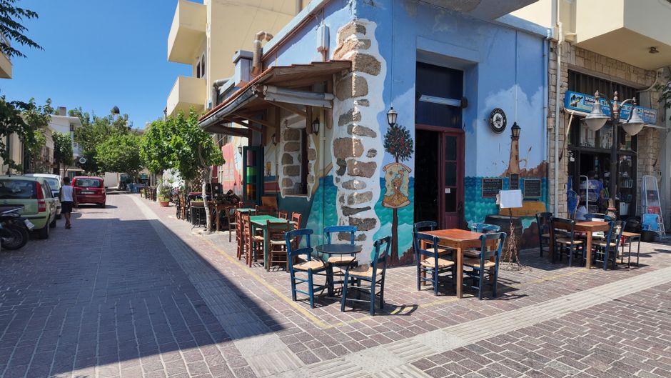 Litochoro main square Greece evening locals drinking ouzo