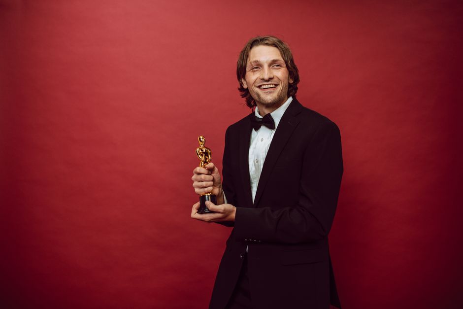 Cristian Mungiu accepting Palme d'Or at Cannes 2024