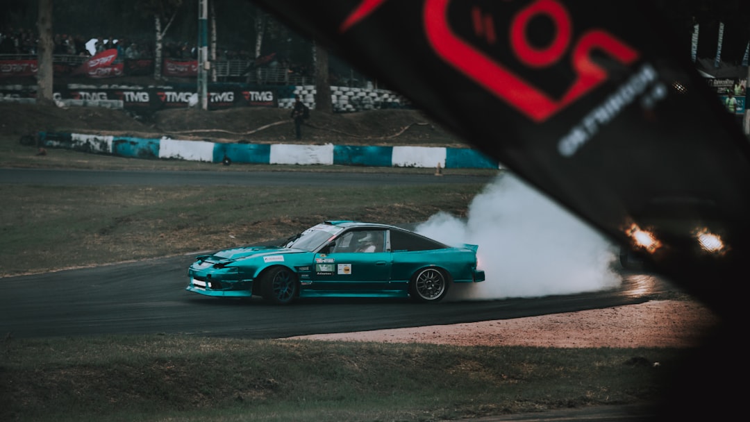 modified drift car sliding on asphalt smoke
