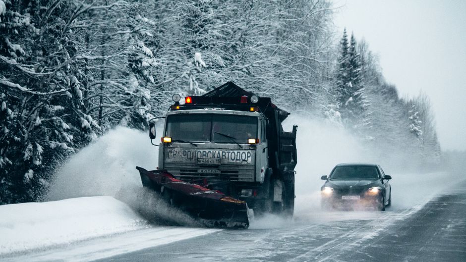 Snowplow clearing highway in Serbia winter storm