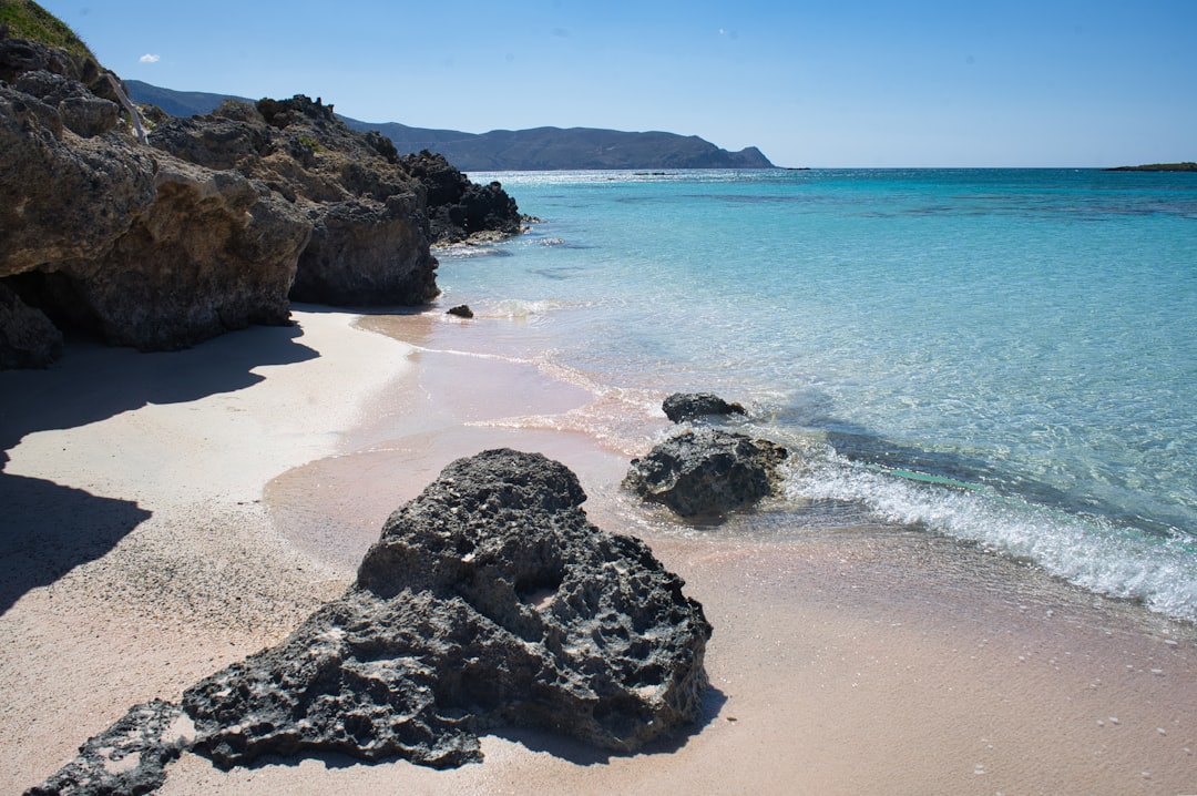 Elafonisi Crete pink sand shallow lagoon sunset