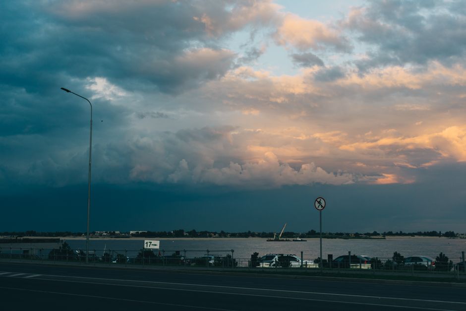 Albanian Riviera coastal road cars traffic sunset