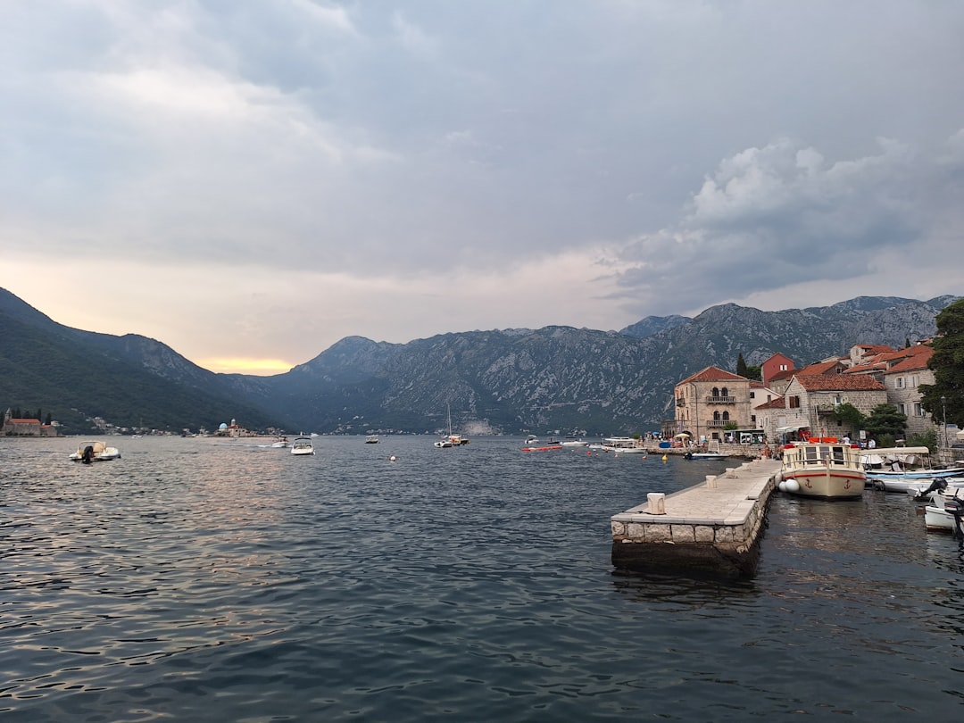 Perast waterfront night view boats bay