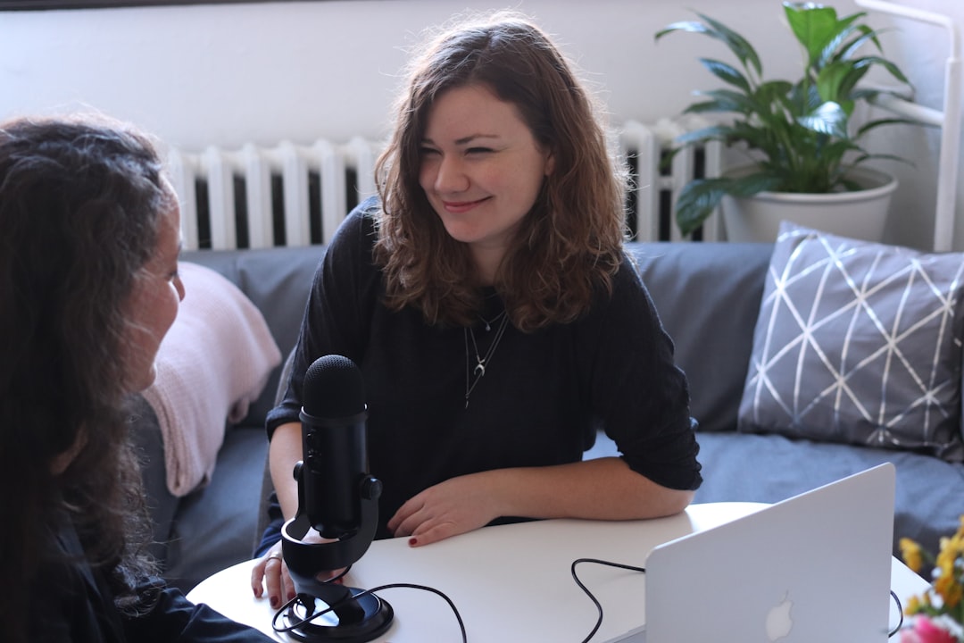 Katrin Papoutsaki smiling during television interview