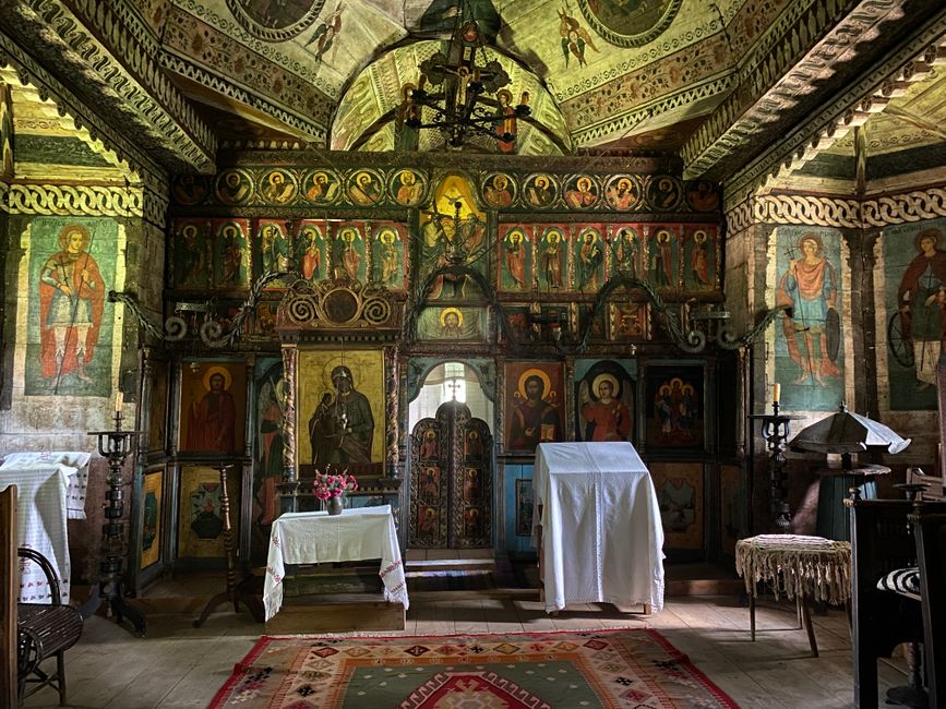 Sogndio Romania church exterior Dance of Death frescoes skeletons