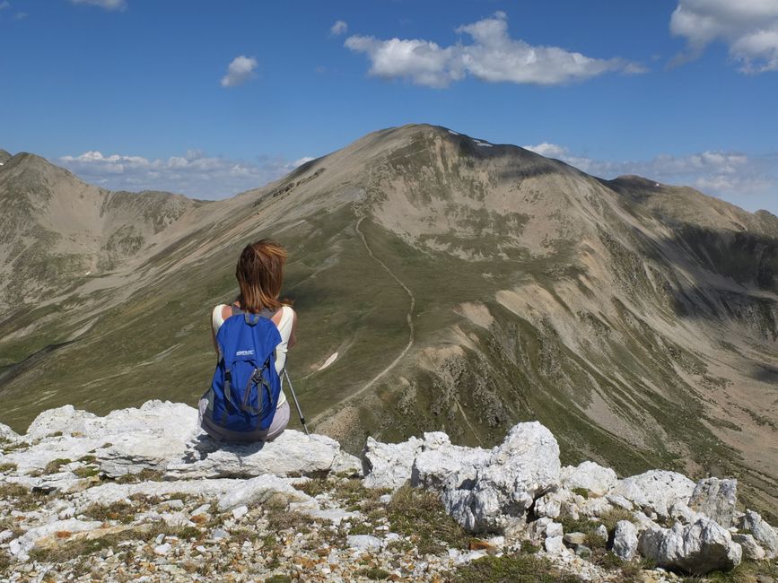 Hiker backpack Via Dinarica trail ridge view sunset