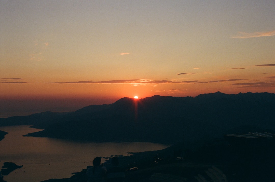Bobotov Kuk summit sunset hiker silhouette Montenegro