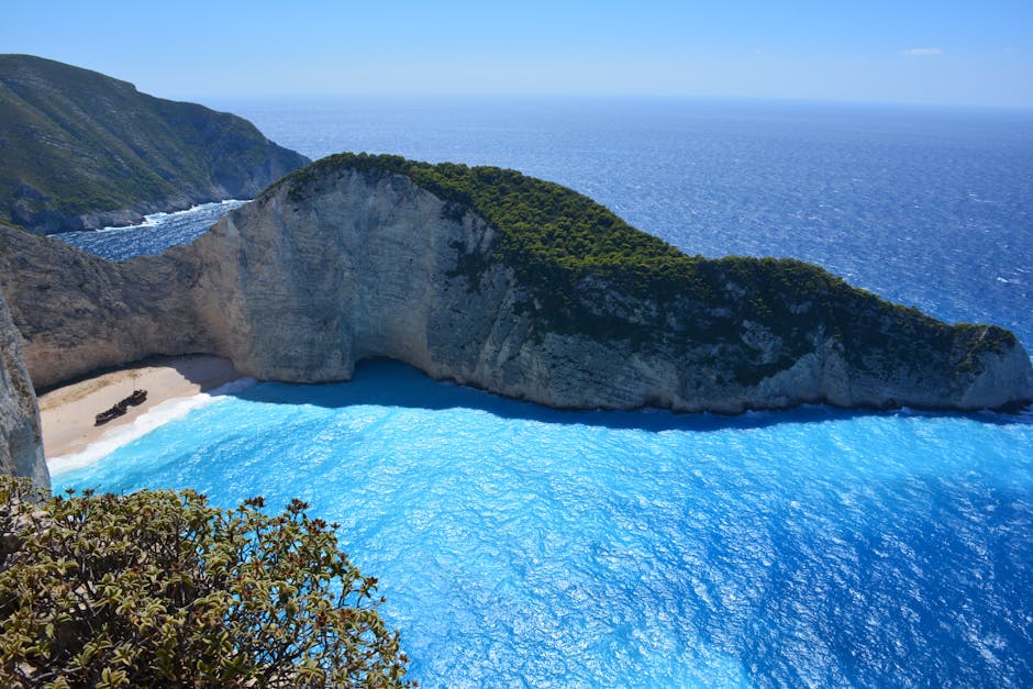 Navagagio Beach Zakynthos turquoise water cliffs kitesurfers