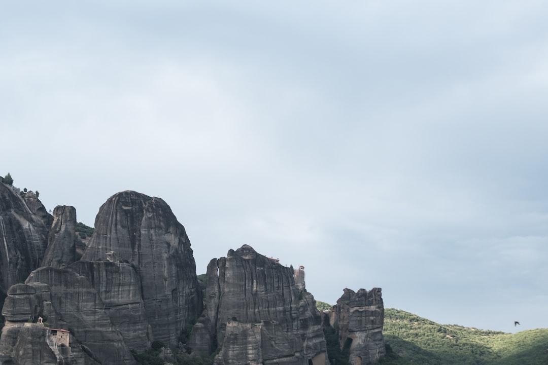 Meteora rock formations Greece towering pillars sunrise mist