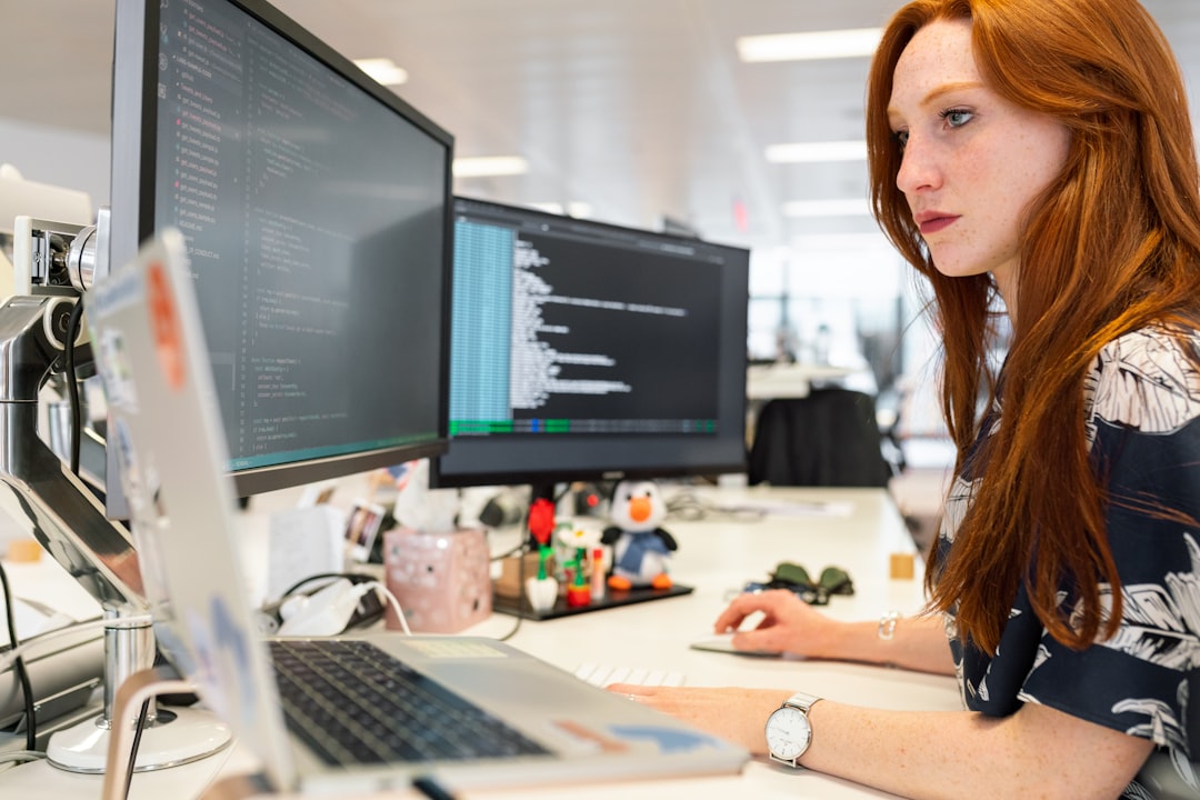 Young female software engineers coding in modern office Balkans