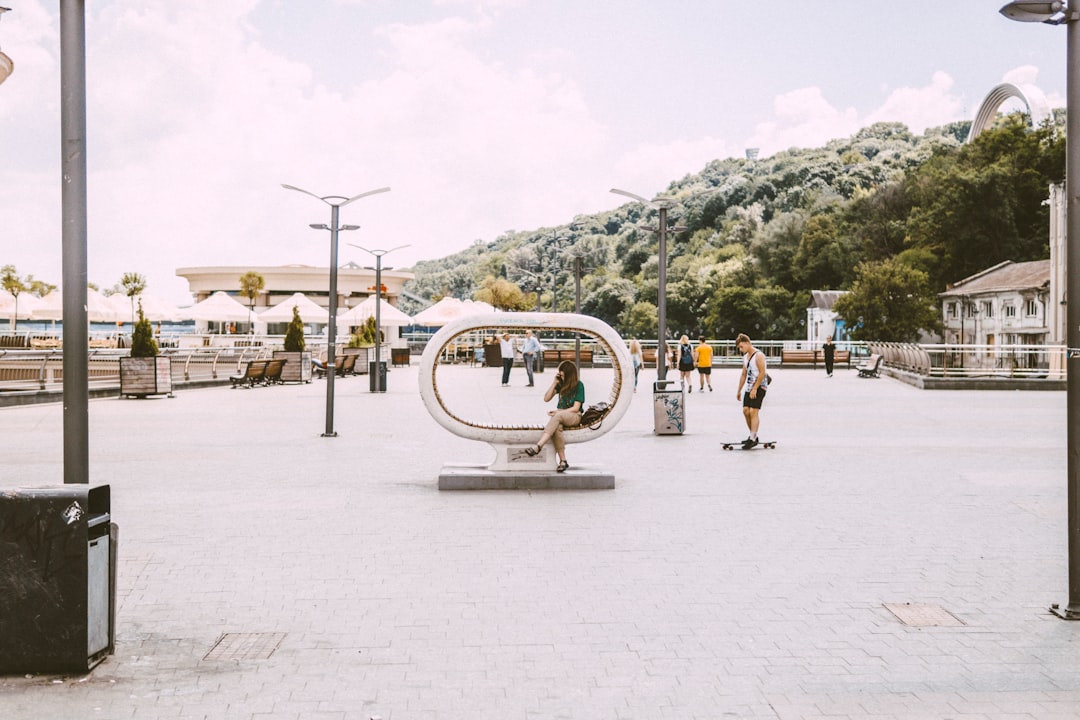 Hero Square Mostar right bank public space people sitting