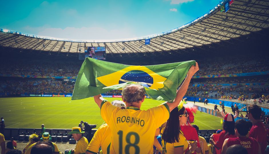 FIFA World Cup trophy with Balkan flags in background