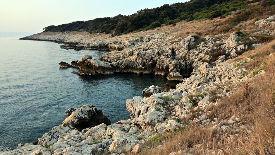 Strunjan Cliffs Slovenia limestone rocks Adriatic Sea sunset