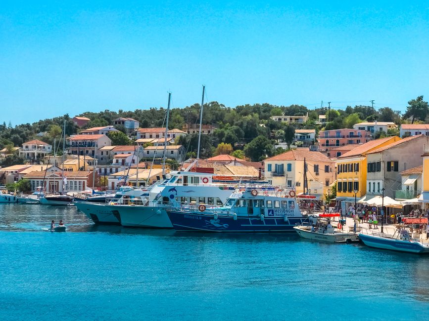 Ayia Efimia harbor Kefalonia traditional fishing boats sunset