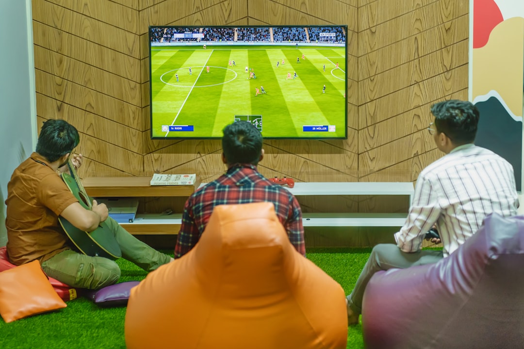 Balkan football fans watching match on screen