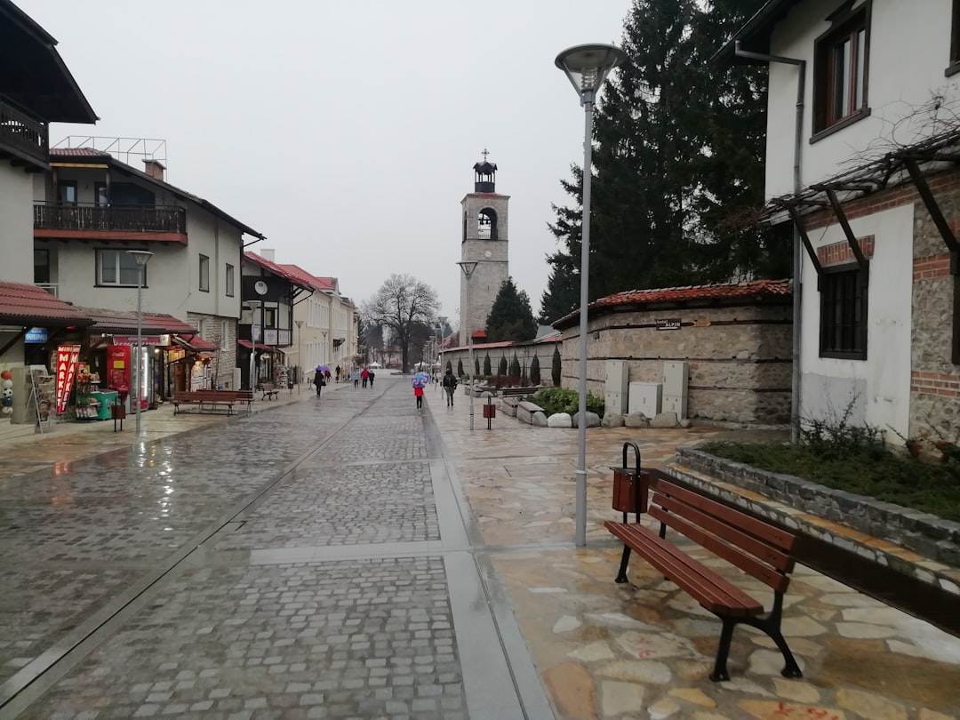 Rila Monastery Bulgaria wooden bell tower complex courtyard pilgrims