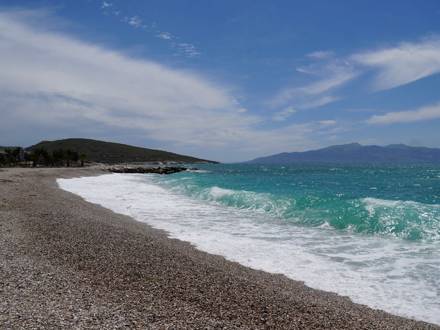 Kokonozi beach Albania pebble shore turquoise water