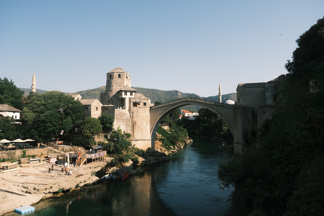 Stari Most bridge Mostar daytime tourists walking across stone arch