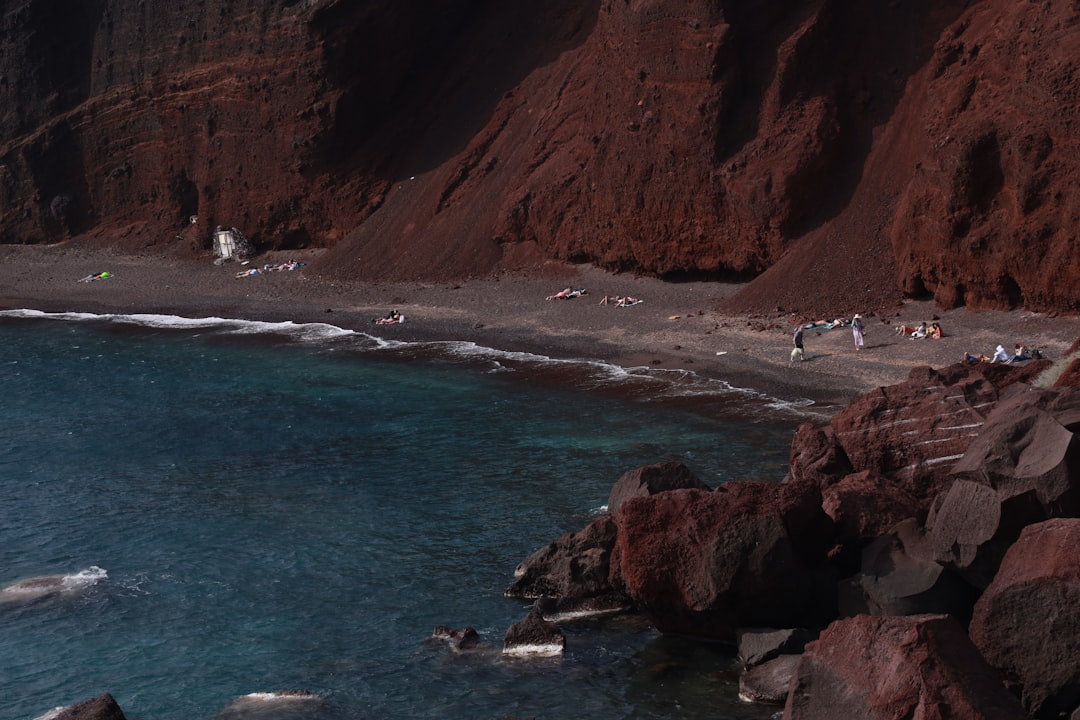 Red Beach Santorini red cliffs volcanic sand clear water