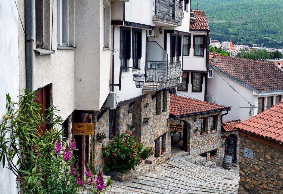 Ohrid Old Bazaar narrow stone street wooden balconies morning light