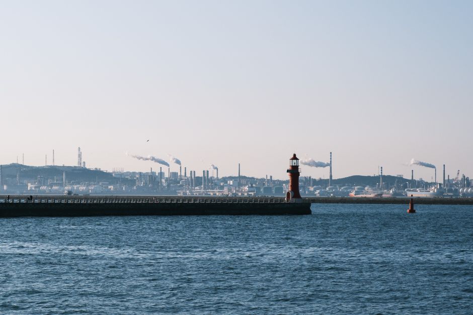 Burgas Oil Refinery Bulgaria smokestacks morning mist industrial skyline