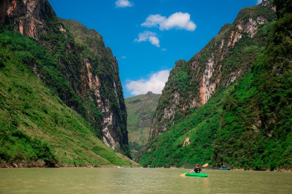kayaker paddling Tara River Montenegro turquoise water canyon walls