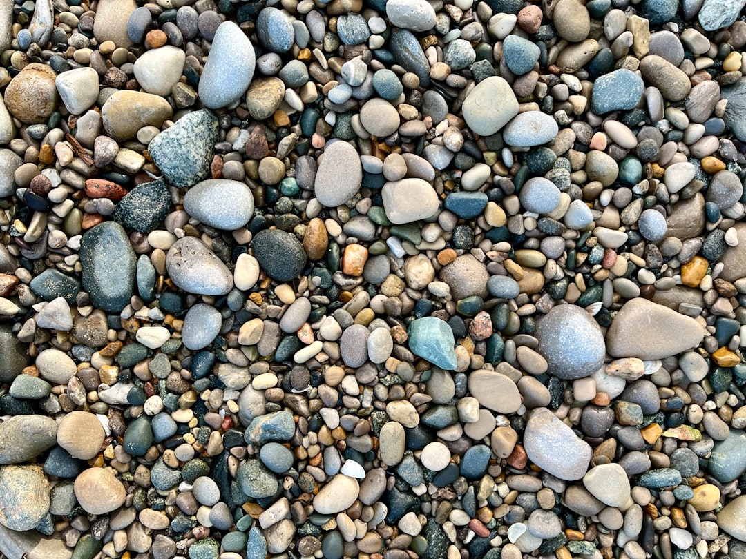 Croatian pebble beach colorful stones white pink gray granite limestone close up