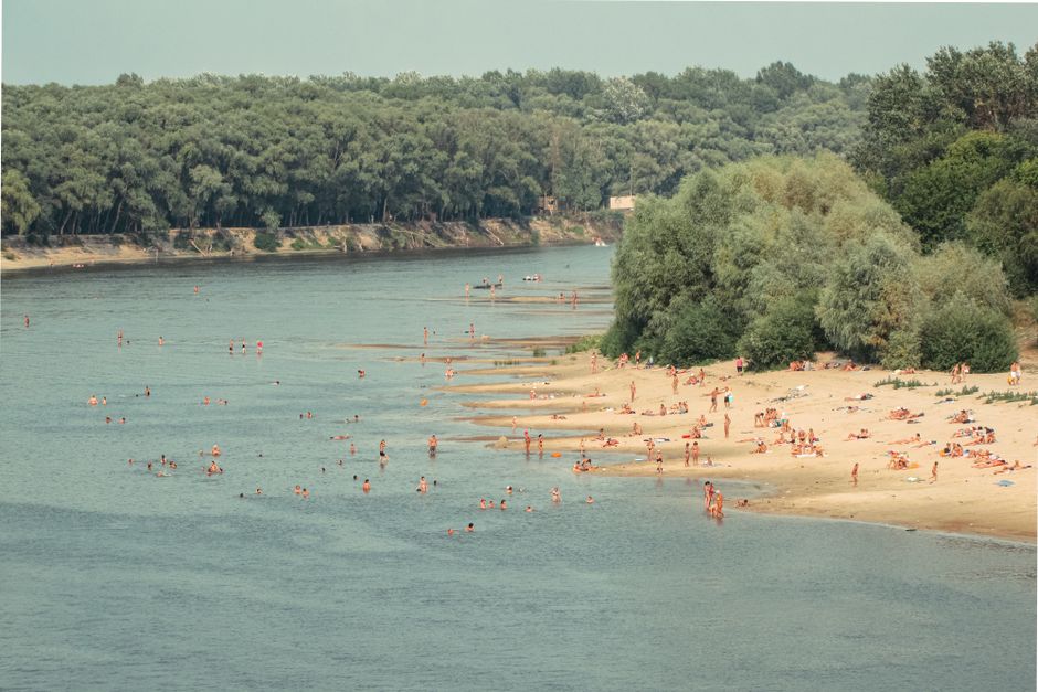 Becmen beach Danube river people swimming sandy shore sunset