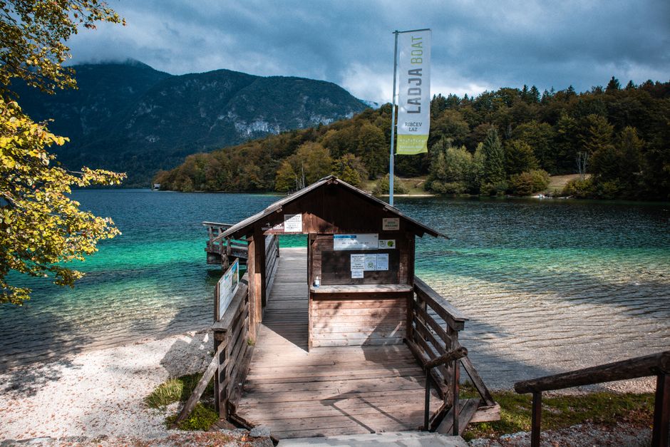 Trail to Seven Lakes of Bohinj Slovenia wooden boardwalk forest mountains background