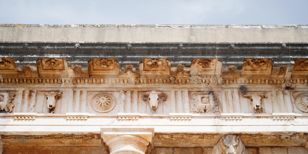 Zadar Roman Forum ruins stone blocks modern city background
