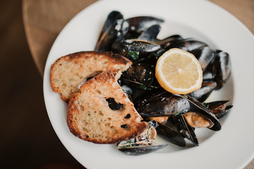 Steamed mussels with white wine Slovenian tavern rustic table