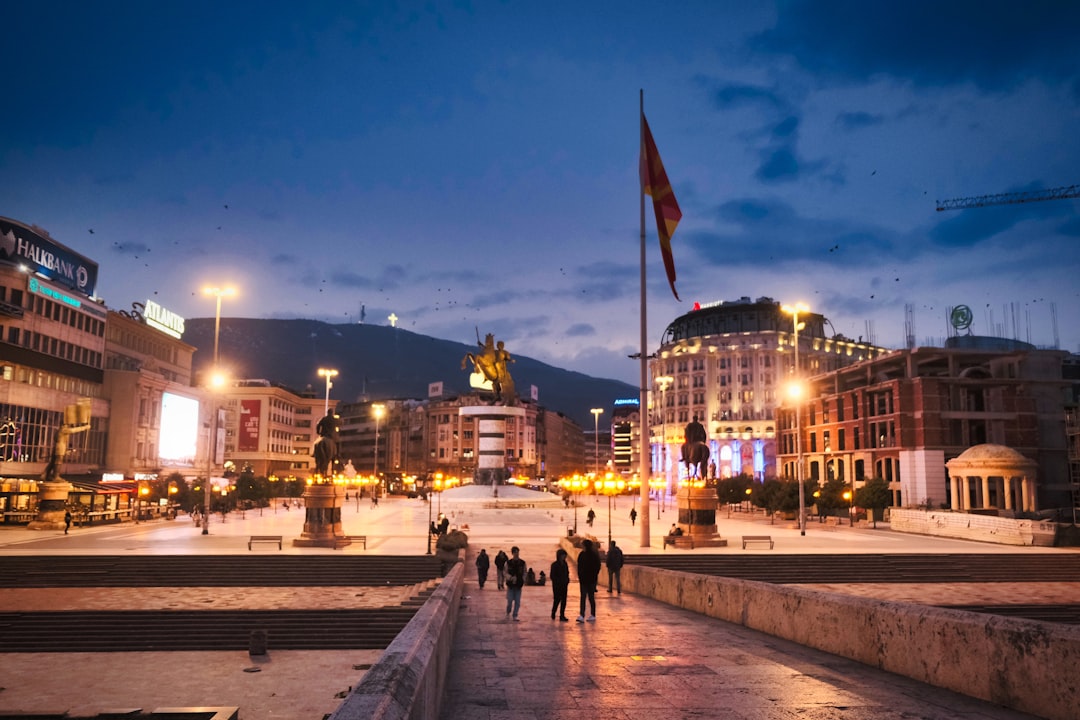 Trg Cemilus square Mostar evening lights people walking