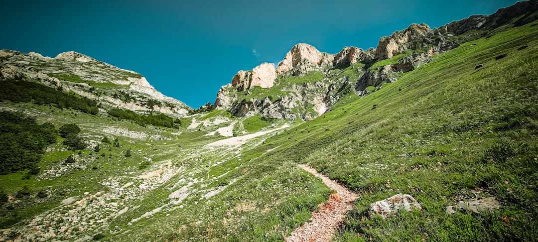 Theth to Valbona trail Albania hikers rocky path mountain view
