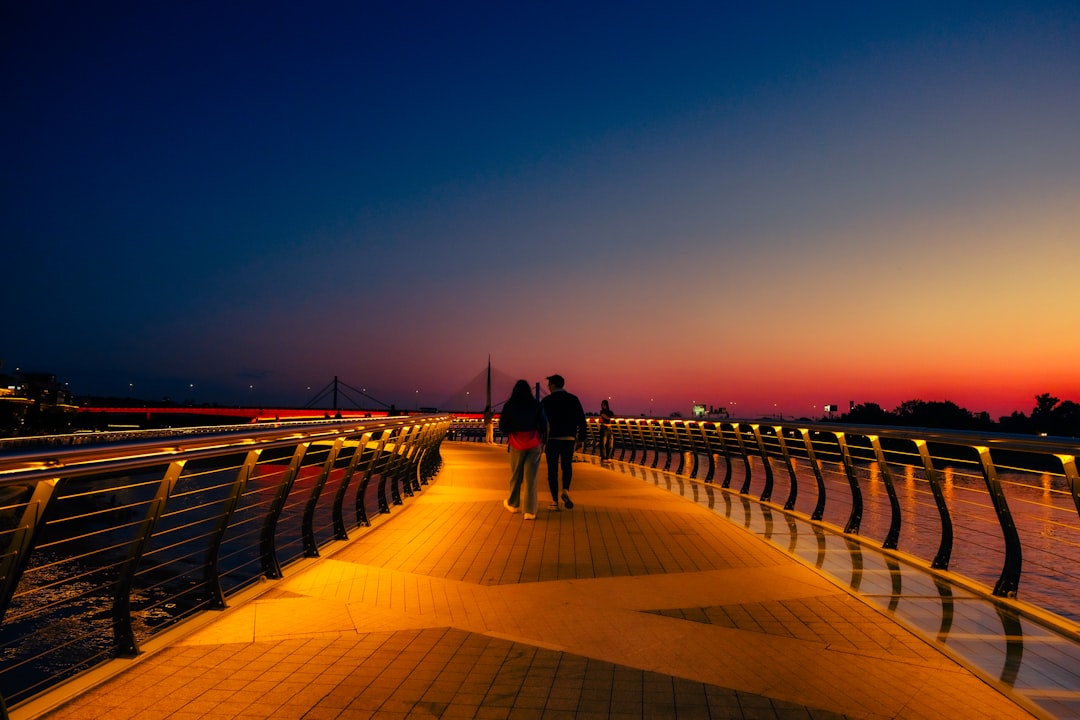 Belgrade Dorcol district Sava riverfront promenade cyclists evening