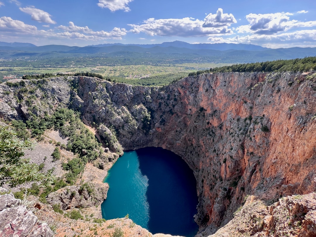 Blue Lake Imotski Croatia deep water and stone bridge