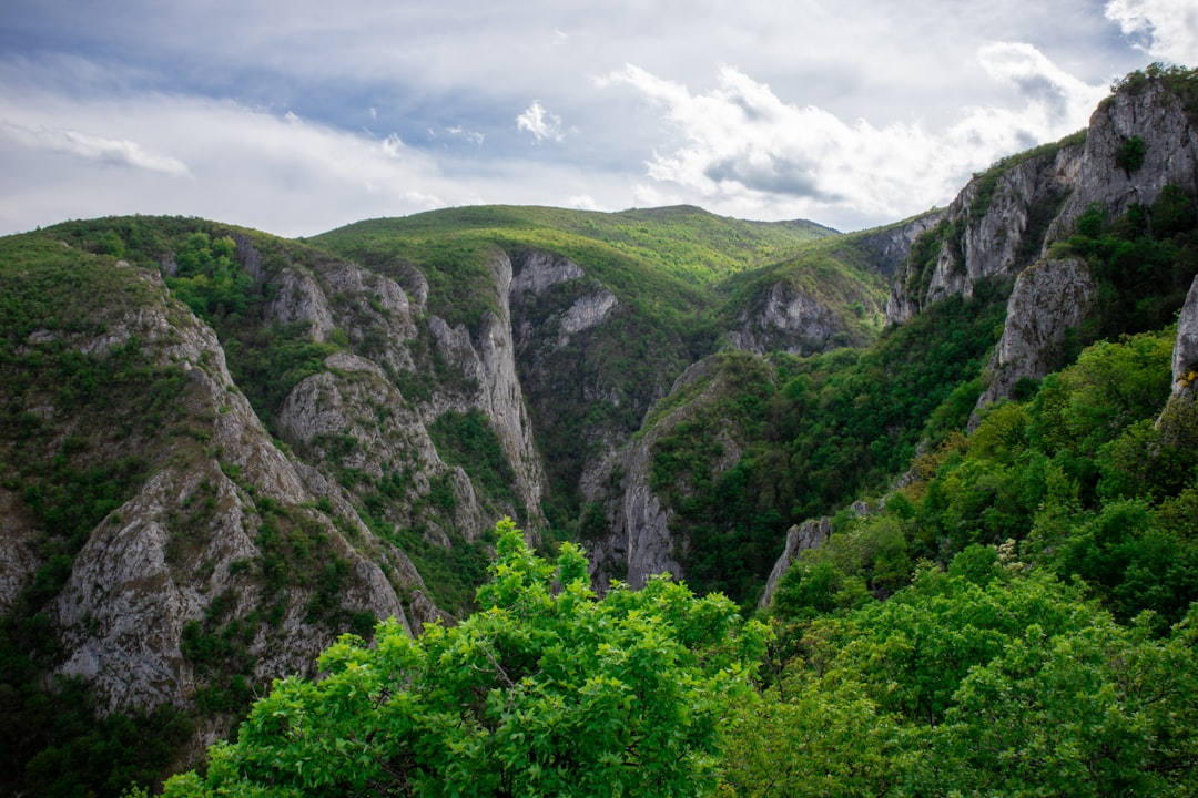 Prokletije Mountains Serbia jagged limestone peaks cloud cover dramatic