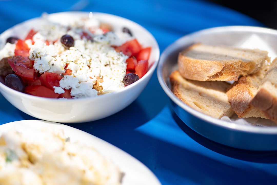 Kalabaka Greece taverna outdoor dining Greek salad and wine
