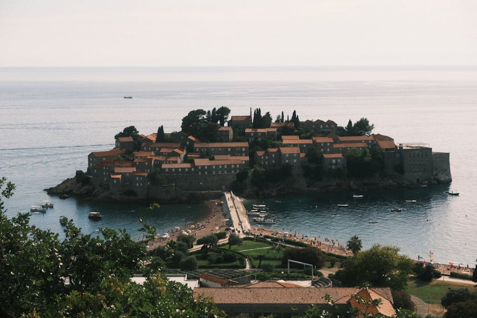 Sveti Stefan Montenegro island resort red roofs sandbar