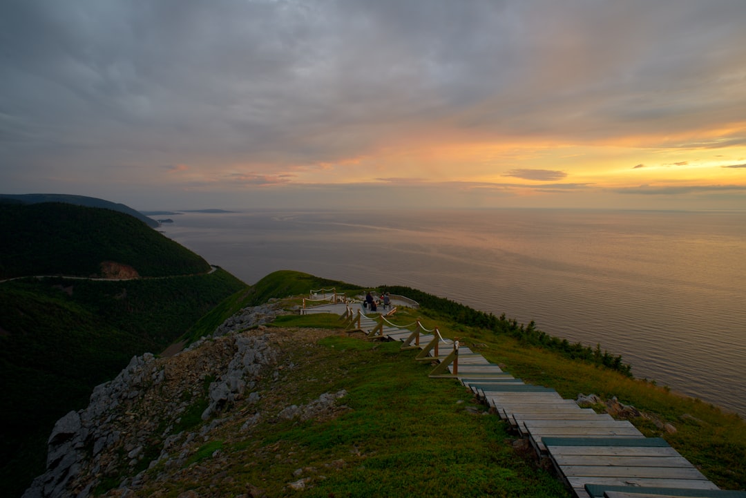 Via Dinarica trail Montenegro steep limestone ridge hiker backpack sunset