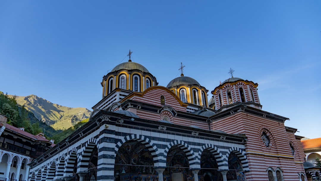 Rila Monastery Bulgaria golden domes intricate frescoes autumn leaves