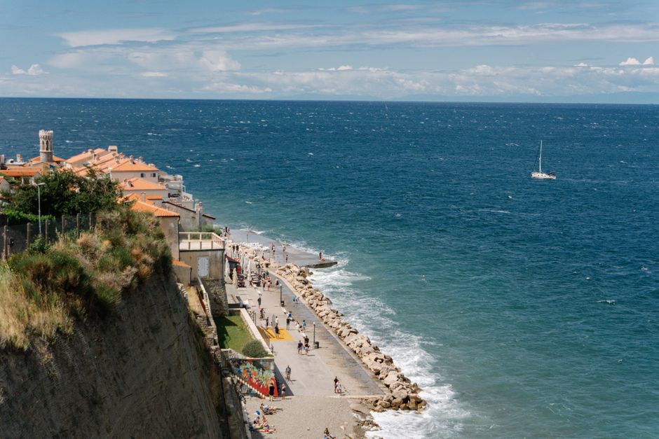 Coastal road Slovenia Piran to Koper cyclist blue sea