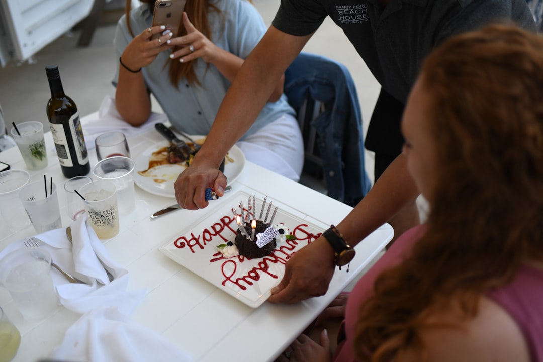 Greek friends celebrating name day cake toast