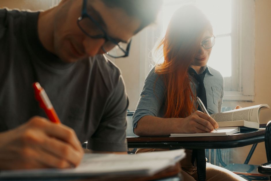 Romanian students taking Baccalaureate exam in classroom