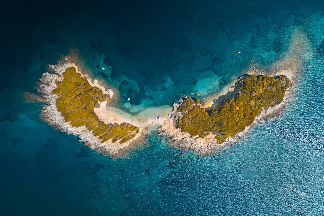 Ksamil Islands Albania small rocky islets clear water boats